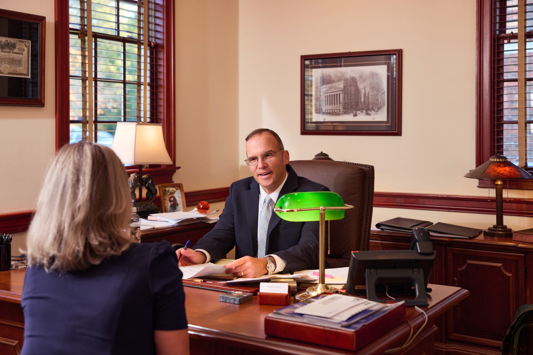 Investment advisor reviewing portfolio allocation with a client at Woodard & Company