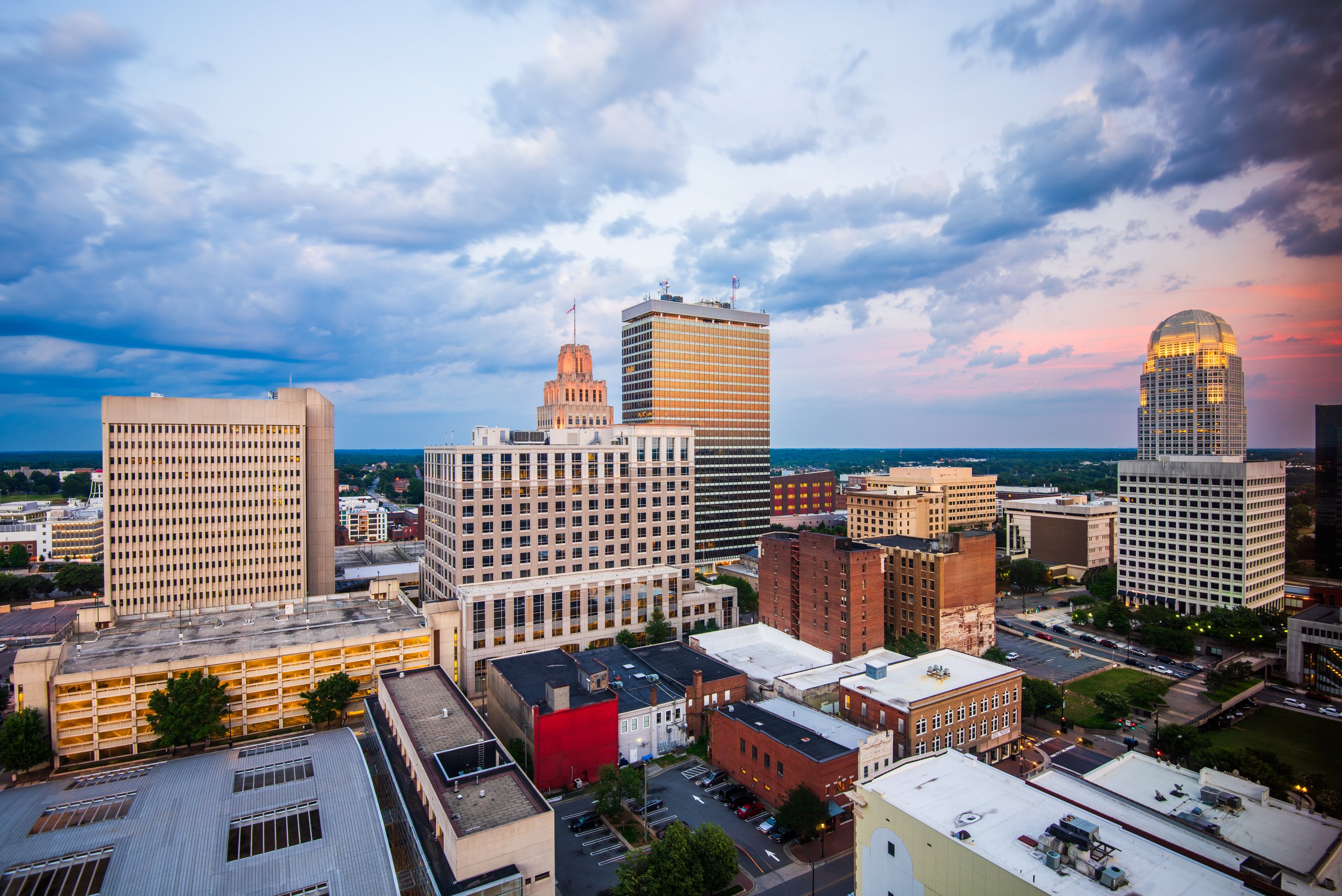The Winston-Salem, North Carolina skyline at dusk, the region Woodard & Company has served since 1985