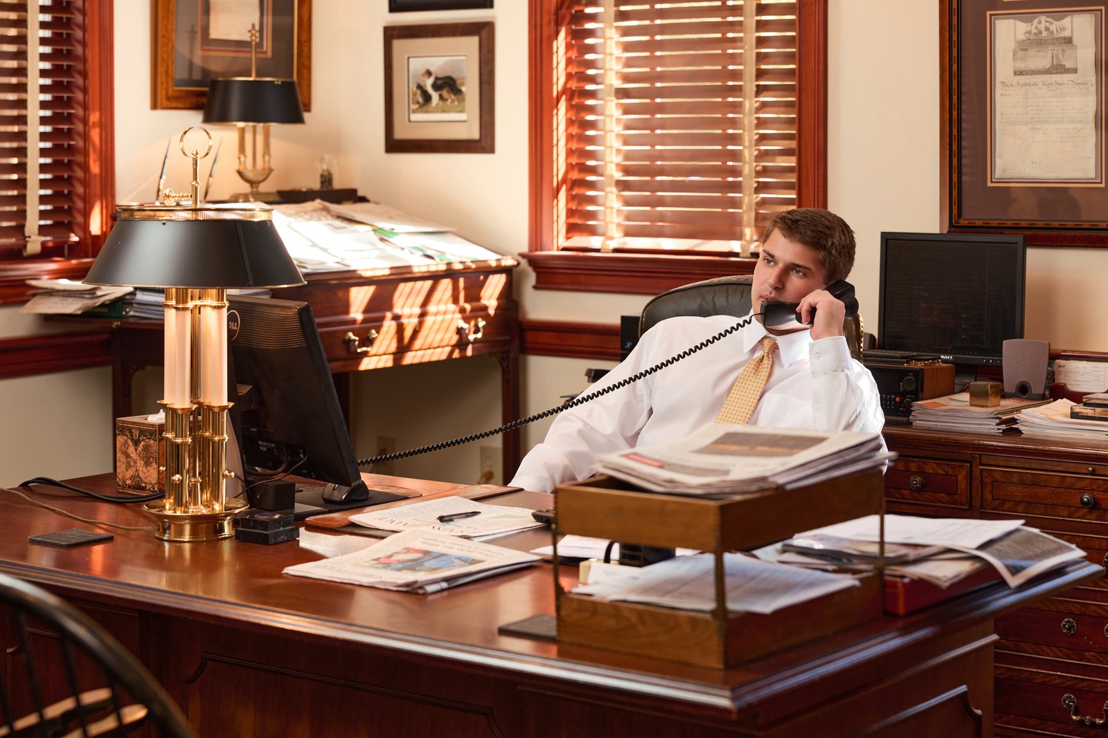 John Woodard III at his office desk